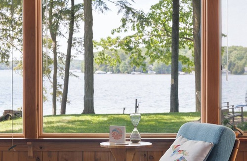 Traverse City Cottage | Long Lake Stone Cottage in Traverse City Frontage Kayaks Fire Pit Pet friendly