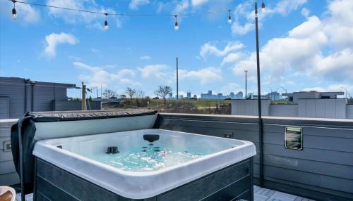 Katie Hill Neighborhood Apartment | Luxe Urban Retreat - Private Rooftop Hot Tub Deck