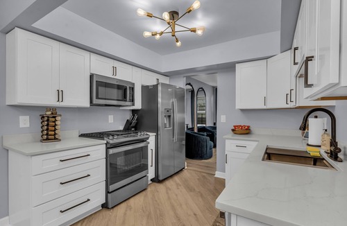 Detroit House | Luxury Cityside Retreat 5 minutes from Downtown Detroit Attached Garage
