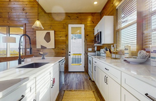 Sevierville Cabin | Luxury lakefront home with private pool, hot tub, & free attraction tickets