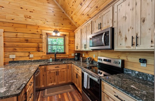 Union Hall Cabin | Main Channel Lots of Water-All Decked Out — new lakefront log home on Smith Mountain Lake with a private hot tub, 50+ ft of wraparound deck, fire pit patio & easy lake access. Two full kitchens. One of 5 cabins on an 8-acre lakefront micro-resort.