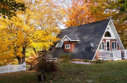 Cornell Ski Chalet | Michigans Upper Peninsula ON the Escanaba River with wooded 5 acres of Privacy.