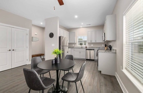 Grandville Apartment | Modern 16BR 16BA Condos w Garage and Patio