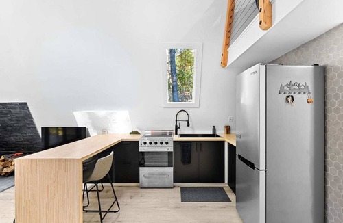 Great Cacapon Cabin | Modern Black A-frame retreat in the woods of Great Cacapon,WV - river access