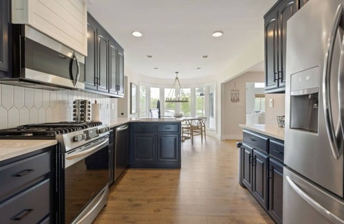 Winchester House | Modern Charm with Rare Flat Lot, Dock, Game Area