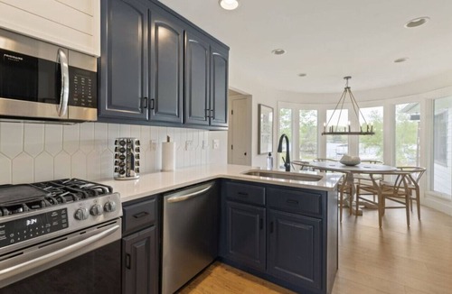 Winchester House | Modern Charm with Rare Flat Lot, Dock, Game Area