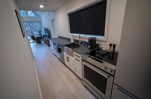 Wellston Ski Chalet | Modern Forest Chalet Sleeps 6 Starlink Rivers & Caberfae Pet-Friendly