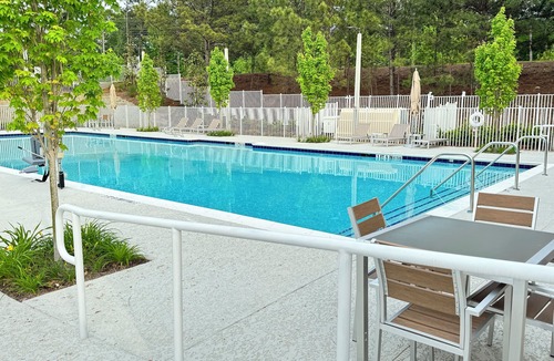 Douglasville Apartment | Modern, Lux Treetop Apt w/access to gym, pool and restaurants steps away!