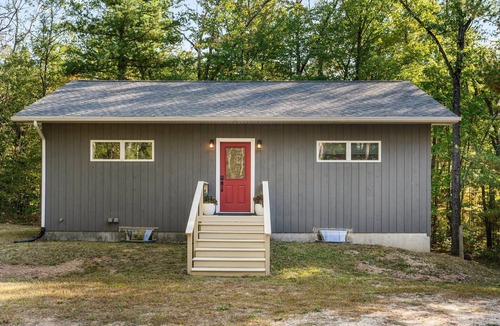 Big Rapids House | Nestled in the woods, this private detached Guest House is a perfect getaway!