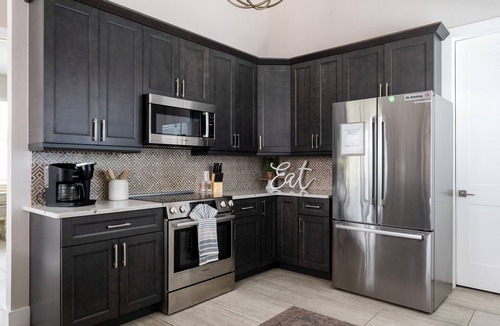 Mid Island House | New 4BR Oasis: Walk to Beach, Pool, Pet-Friendly!