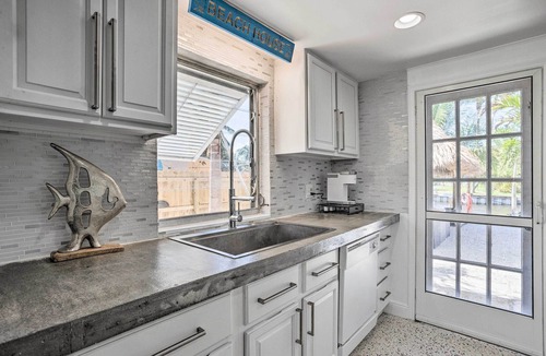 Palm City House | Palm City Canalfront Home w/Boat Dock & Fire Pit!