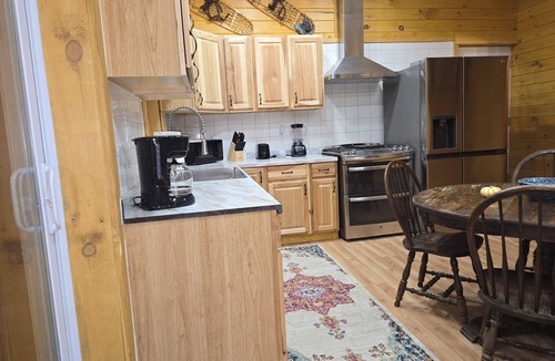 Irons Cabin | Peaceful 2-bedroom cabin with AC in charming Irons, hot tub, sauna, covered deck