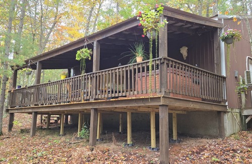 Irons Cabin | Peaceful 2-bedroom cabin with AC in charming Irons, hot tub, sauna, covered deck