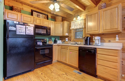 Gatlinburg Cabin | Pet-friendly retreat with tree-top views, a hot tub + an arcade loft!