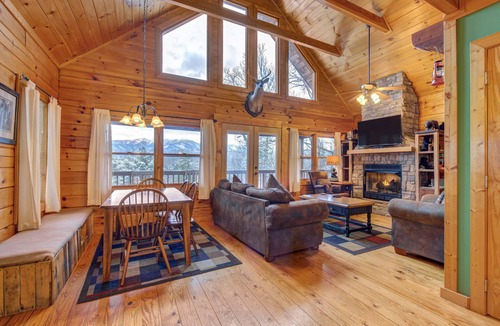 Gatlinburg Cabin | Pet-friendly retreat with tree-top views, a hot tub + an arcade loft!