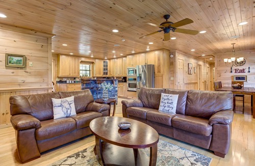 Copperhill Cabin | Pond-front cabin with private hot tub, fireplaces, furnished deck, & game room