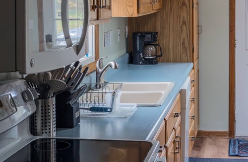 Gaylord House | Private Lake Front, Fire Pit, Grill, Backyard, AC, Hot Tub