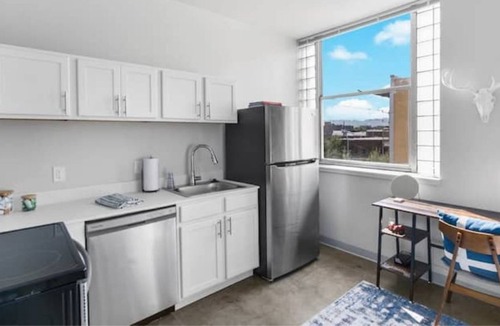 Central City Apartment | Private loft with rooftop deck, fitness center, and private parking.