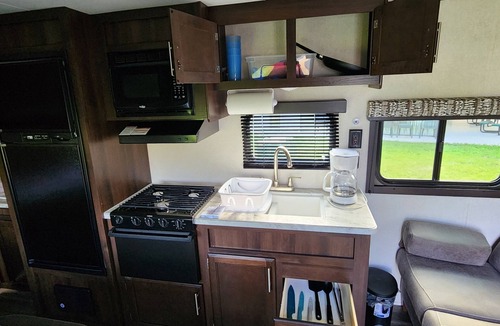 Oshkosh RV Rental | Private Paradise Camper Beach, Pond, Firepit