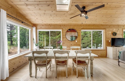Evart Cottage | Quiet, private and wooded waterfront on a huge lot. King beds. Boats included!