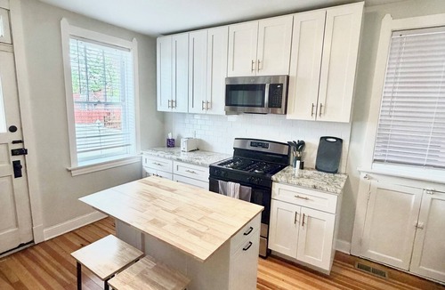 Benton Park Apartment | Relax on a private balcony with queen bed fast WiFi and full kitchen