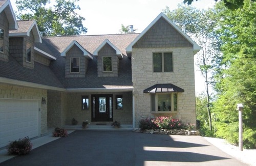Egg Harbor House | Relax or do nothing at all high on the bluff with water views second to none.