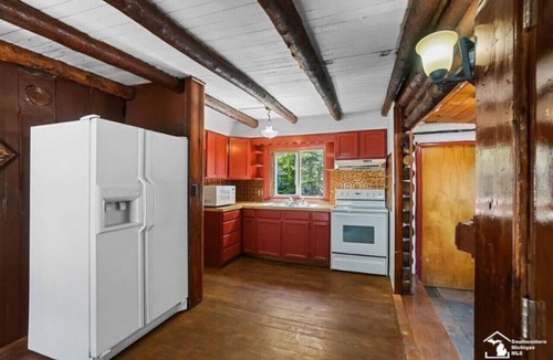 Luna Pier Cabin | Restored historic log cabin and deck on Lake Erie