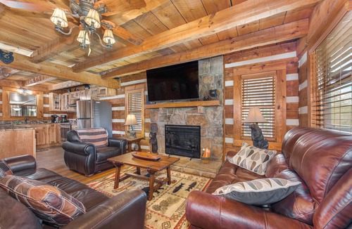 Sevierville Cabin | River-View Home w/Multi-Level Deck, Yard, Hot Tub, & Free Attraction Tickets