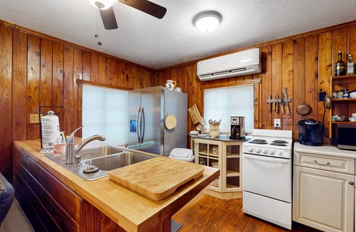 Bonita Springs Cottage | Riverfront dog-friendly cottages with kayaks, dock, patio, grill, & water views