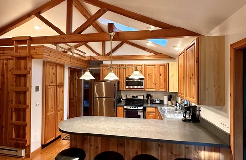 Rapid City Cabin | Riverside Cabin Near Torch Lake – Kayaks Included!