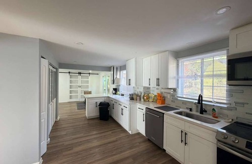 Charlotte House | Room for everyone in this spacious 5-bedroom retreat! Gather, relax, and unwind with a luxurious king suite, a fun pool table, and fast Wi-Fi — perfect for family reunions and group getaways alike.