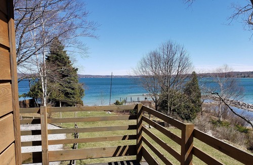 Onekama House | Secluded Home w/private Portage Lk dock & beach next to Lk Michigan beach