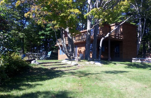 Onekama House | Secluded Home w/private Portage Lk dock & beach next to Lk Michigan beach
