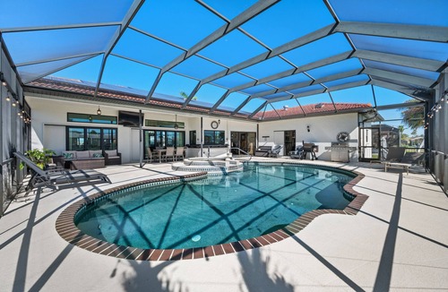 Edgewater House | Spacious 4-bedroom, harbor Acces ON canal, fish of the dock Rv parking POOL SPA