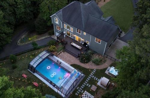 Candler House | Spacious 6 Bedroom Home with a Heated Salt Water Pool, Theater & Game Room
