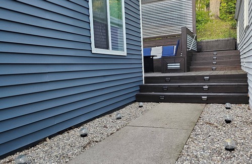 Alden House | Spacious home near Torch Lake w/custom back patio, steps away from public access
