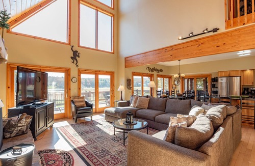 Waterfront Greens House | Spacious Lake Escape w/Hot Tub, Dock & Fireplace