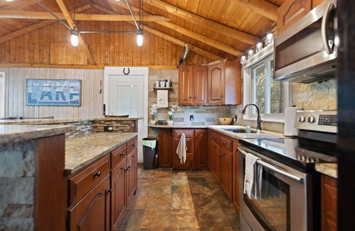 Burnside House | Spacious Lakefront Retreat with Private dock for swimming and fishing. Sleeps 14