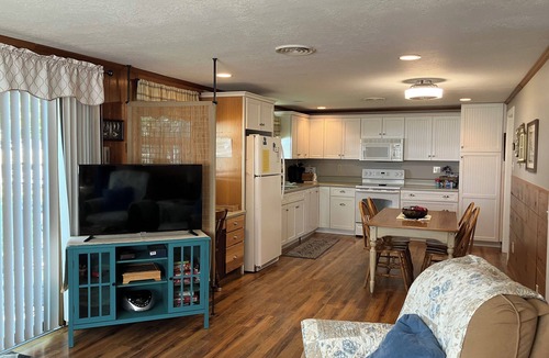 Coldwater Cottage | Spectacular sunset views and north chain lake front red cottage rental