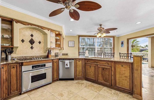 Pelican House | Striking European-style home w/private pool, hot tub & river access via dock