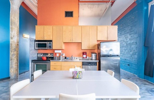 West Main Historic District Condo | Stunning Downtown Louisville Top Floor Corner Loft with Views