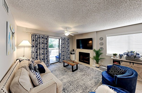 Arcadian Shores Condo | Stylish home with oversize deck & updated kitchen - walk to beach, pools, & gym