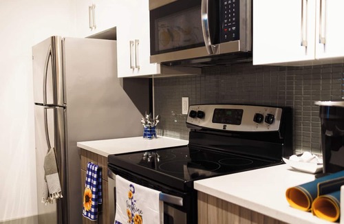 Westside Apartment | Stylish West Midtown Retreat with Rooftop Pool, Steps to the Stadium