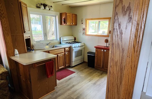 Cheboygan County Cottage | Sunset Shores 3 Bedroom 1 Bath Lakefront Burt Lake Cottage- Sleeps 6