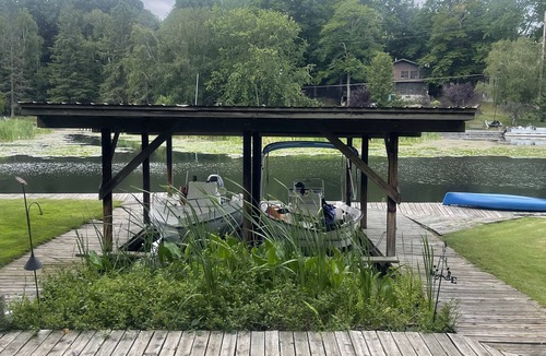 Ludington Cottage | The Bay Cottage has wonderful views of Hamlin lake from its deck 50’ from lake