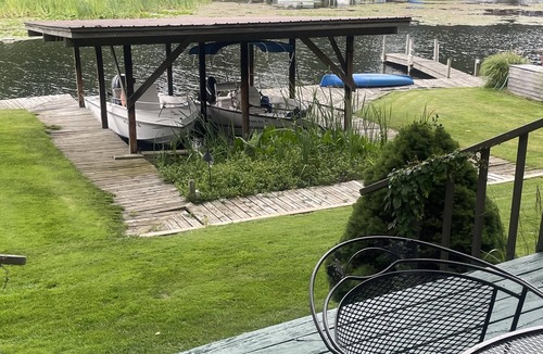 Ludington Cottage | The Bay Cottage has wonderful views of Hamlin lake from its deck 50’ from lake