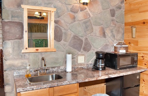 Flintstone Ski Chalet | The double cabin has 2 queen beds, 1 king bed, 1 sleep sofa for 1 child. Cabin has common porch and each unit has a private entrance.