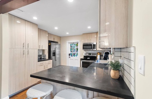 West Palm Beach House | Two-House Lakefront Retreat w/Heated Pool, 6 Person Hot Tub, Kayaks & Fire Pit