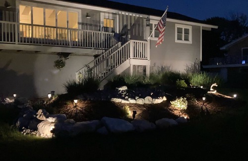 Ludington House | Upper level rental with large family room and huge wrap around deck full kitchen