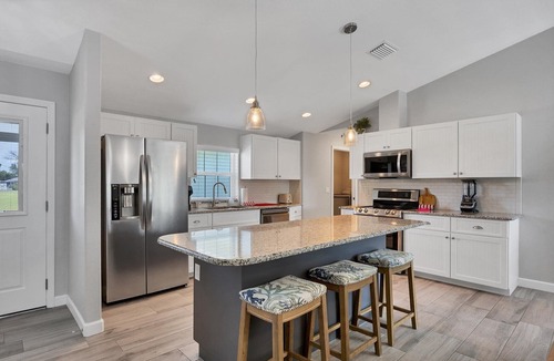 Englewood East Villa | Waterfront Escape: Heated Saltwater Pool & Canal Views!